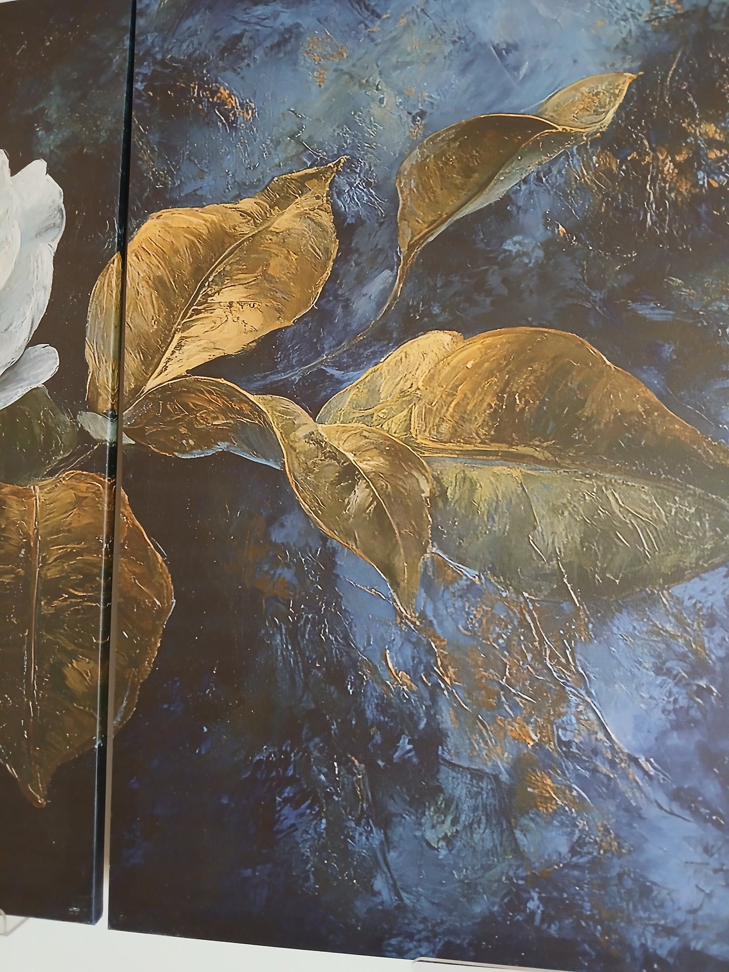 White Floral Canvas Wall Art with Gold Accents on Deep Blue Background